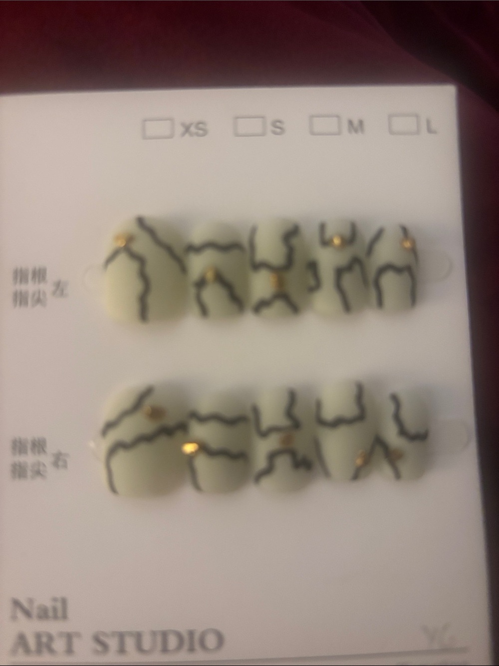 Sage Green Press-On Nail Set with Black Marble Lines and Gold Studs